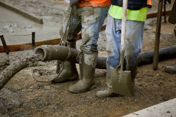 istock Concrete pumper directs the flow from the hose 2172537690