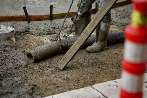 istock Concrete pumper directs the flow from the hose 2172537697