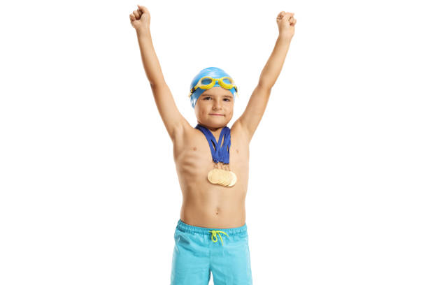 istock Child swimmer posing with medals and gesturing happiness 2172537948