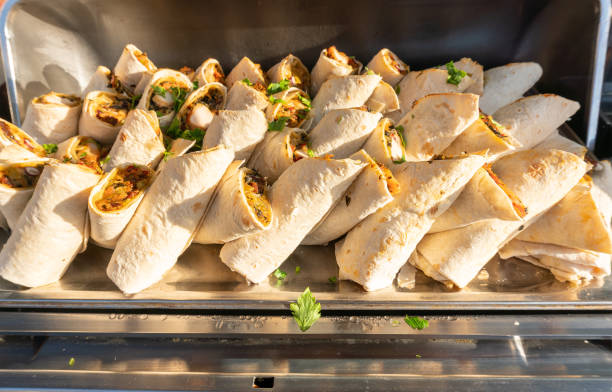 istock Lavash Rolls with Filling on a Tray, Burritos in Sunset Light 2172538487