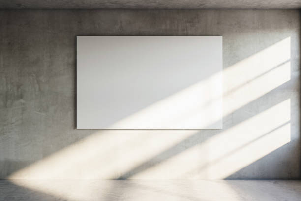 istock Modern concrete room with blank poster on wall, sunlight casting shadows. 3D Rendering 2172539988