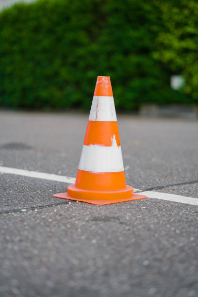 istock Used Orange Traffic Cone Marking a Street 2172540018
