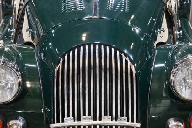 Classic car front part detail in green tone. Horizontal