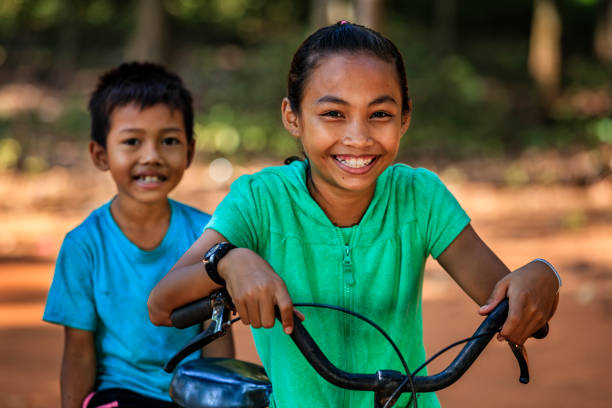 istock Cambodian children riding bicycle, Cambodia 2172540820