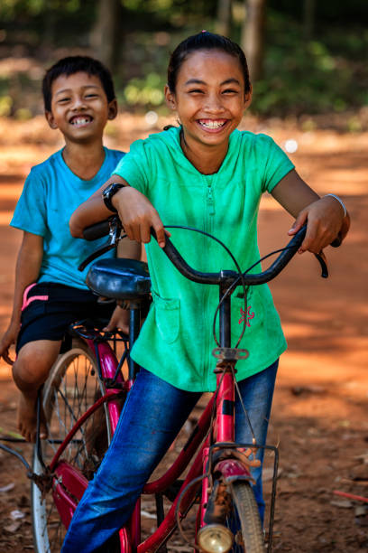 istock Cambodian children riding bicycle, Cambodia 2172541415