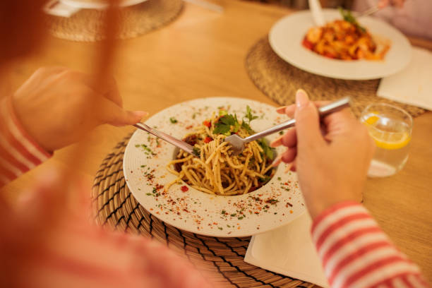 istock Woman eating pasta in a restaurang 2172541767