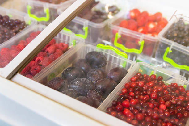 Frozen berries and fruits on a store counter close-up