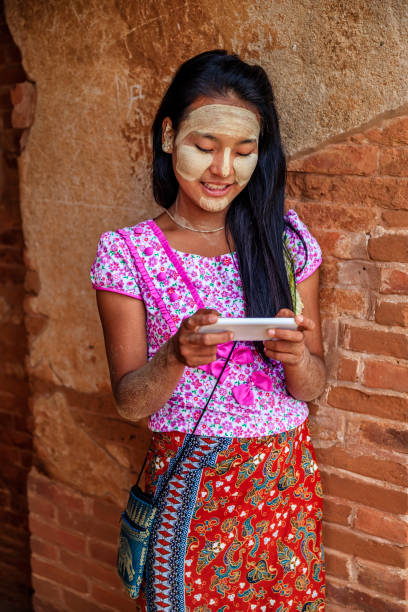 istock Young Burmese girl using a mobile phone in Bagan, Myanmar 2172542757