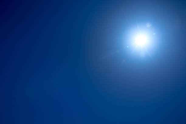 istock Sun shining in blue sky. Sunny background. Blue sky background. 2172543778