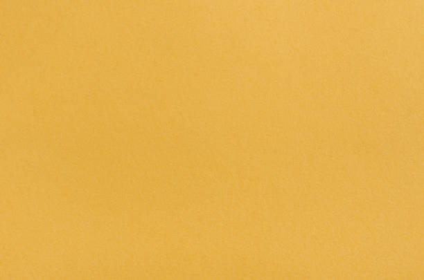 istock yellow paper texture background. texture of colored yellow paper 2172543890