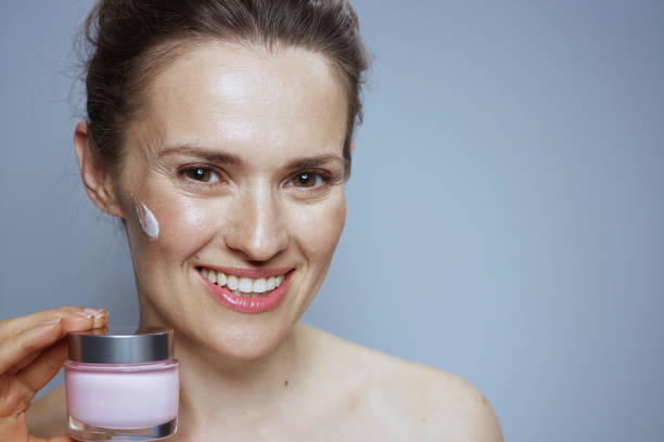 istock happy modern female with cosmetic cream jar 2172544300