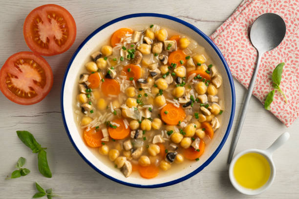 istock Chickpea and rice soup with mushrooms and vegetables. Top view table with  decorations. 2172546840