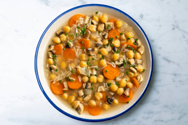istock Chickpea and rice soup with mushrooms and vegetables. Top view table with  decorations. 2172546845