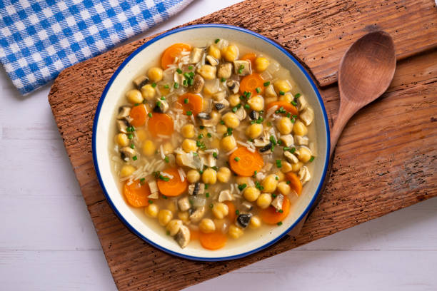 istock Chickpea and rice soup with mushrooms and vegetables. Top view table with  decorations. 2172546849