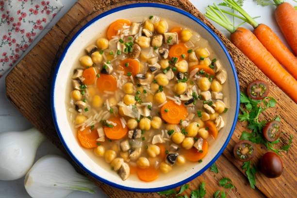 istock Chickpea and rice soup with mushrooms and vegetables. Top view table with  decorations. 2172546850
