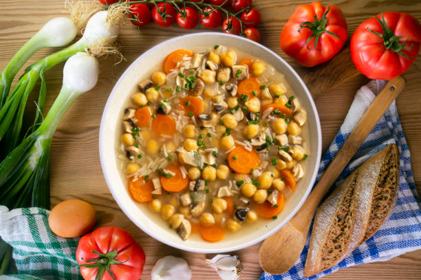 istock Chickpea and rice soup with mushrooms and vegetables. Top view table with  decorations. 2172546858