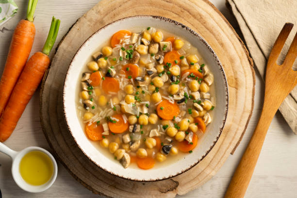 istock Chickpea and rice soup with mushrooms and vegetables. Top view table with  decorations. 2172546864