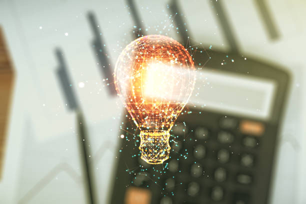 istock Abstract virtual light bulb illustration on blurry calculator and papers background, future technology concept. Multiexposure 2172546889