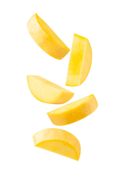 istock Falling Yellow Mango slices isolated on white background with clipping path, full depth of field 2172551695
