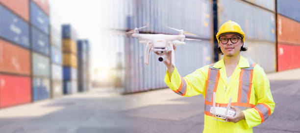 istock Logistic engineer is flying drone around container yard for daily inspecting. 2172552538