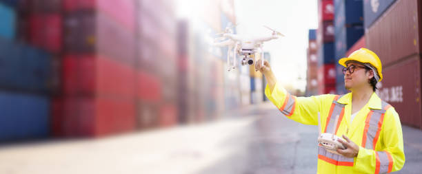 istock Logistic engineer is flying drone around container yard for daily inspecting. 2172552565