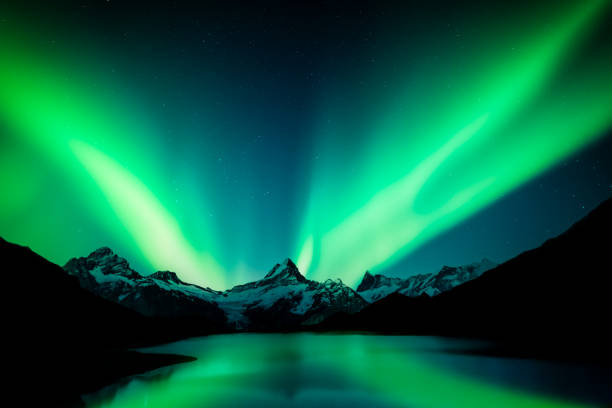 istock Northern lights in winter mountains 2172552933