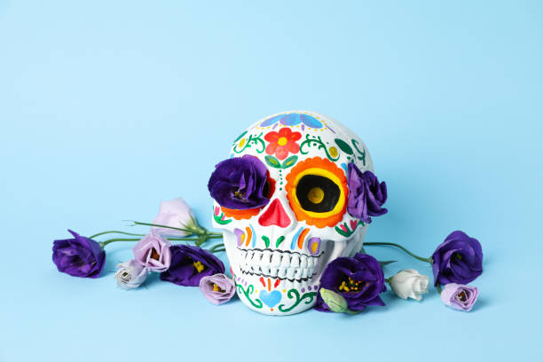 istock Mexican skull and flowers on blue background 2172554402