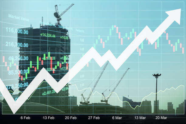 istock Stock financial index data forecast on construction industry investment growth with graph, chart, candlesticks and arrow up on silhouette skyscraper site and working tower crane. 2172555865
