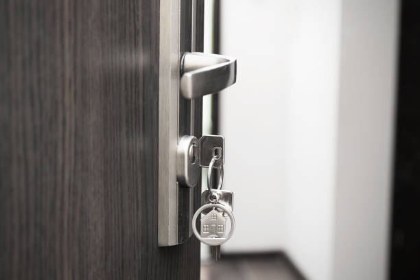istock Open door with keys, key in keyhole 2172556209