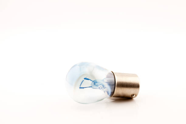 Car light bulb with filament for tail, brake and indicator lights. Selective focus with shallow depth of field.