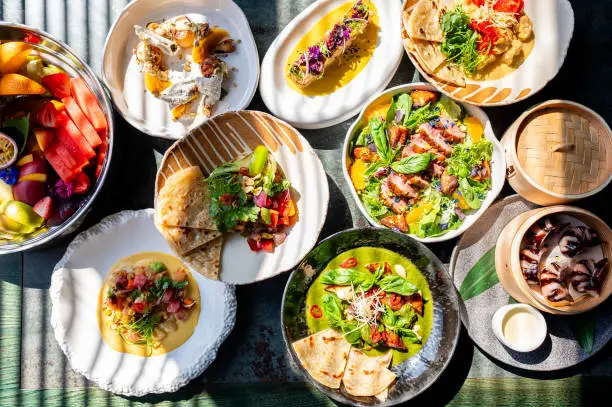 variety of colorful dishes arranged on a table, showcasing a diverse and appetizing meal. vibrant presentation highlights fresh ingredients and culinary creativity, perfect for food-related content. variety of colorful dishes arranged on a table, showcasing a diverse and appetizing meal. vibrant presentation highlights fresh ingredients and culinary creativity, perfect for food-related content.