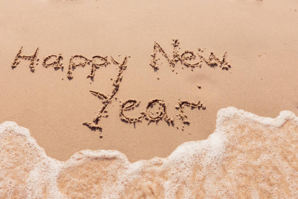 istock inscription happy new year on the seashore 2172559966