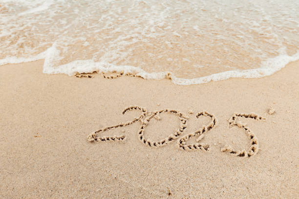 istock Christmas inscription 2005 on the beach 2172560096