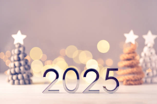 istock Metal numbers 2025 on table with bokeh lights. 2172561583