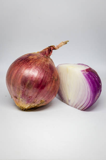istock Cut the shallots in half by slicing. 2172561649