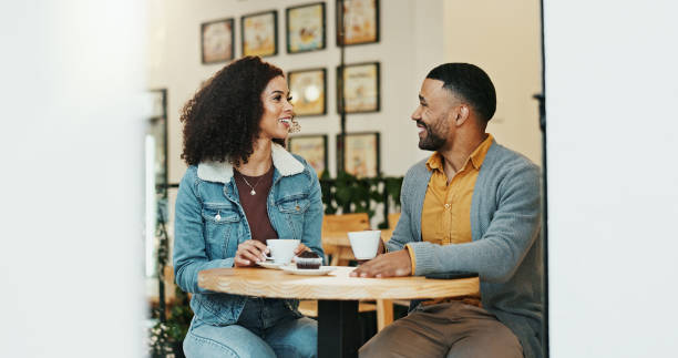 istock Date, coffee and couple with smile, cafe and bonding with conversation, communication or together. Morning, breakfast and woman with muffin, love and talking to man with care or happy in relationship 2172564682