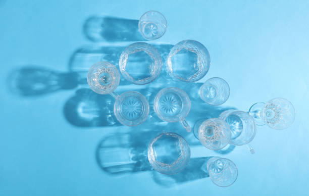 istock Drink glasses with shadow on a blue background. Top view. Minimalism, creative layout 2172565338