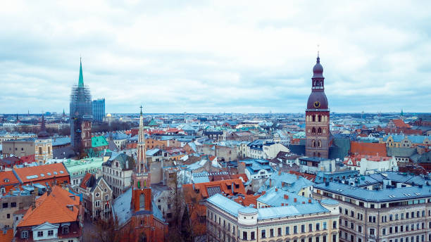 istock A panoramic view of Riga's historic skyline featuring churches, rooftops, and modern architecture under a cloudy sky 2172566538