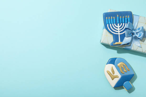 istock Gingerbread cookies and gift box on blue background, space for text 2172567909