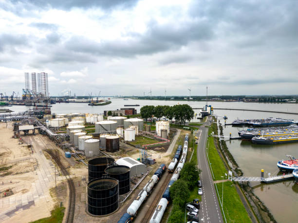 Rotterdam, Netherlands - April 1, 2024: A network of oil storage tanks and pipelines at the Vopak facility in Rotterdams port, emphasizing the infrastructure for energy logistics and distribution.
