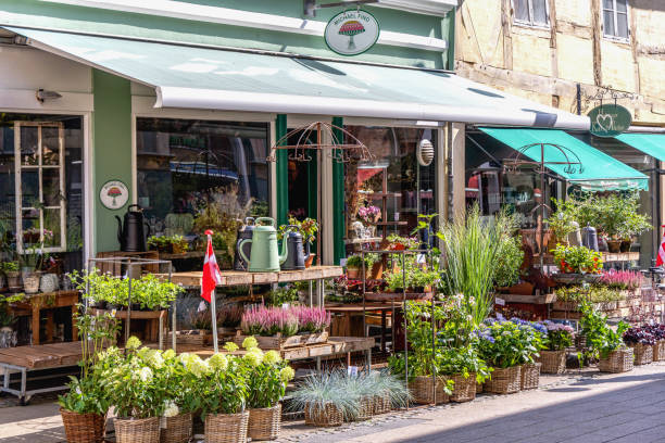 A beautiful Danish flower shop with a flag and a large selection of flowers. Helsingor, Denmark - September 17, 2024