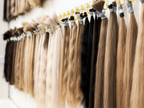 istock Assorted hair extensions displayed in various colors and textures at salon 2172572023