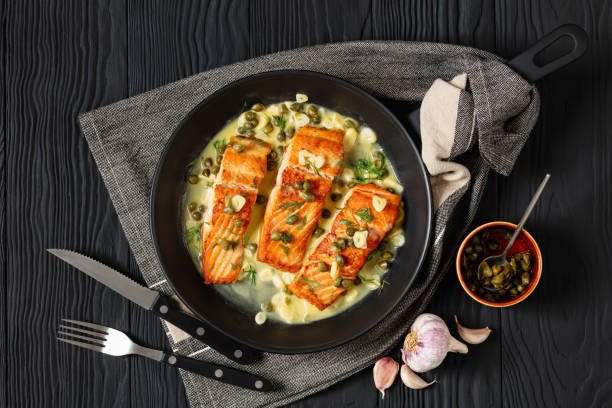istock salmon piccata with lemon caper sauce in a pan 2172572441