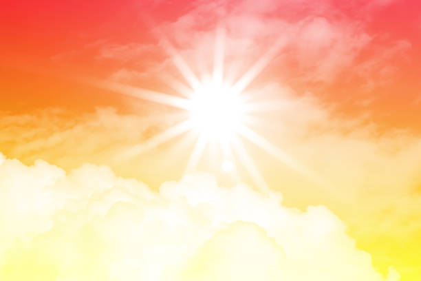 DSLR photo of a bright sun with beautiful beams in the sky with clouds. Toned image, space for copy.