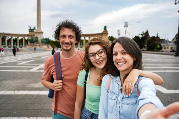istock Joyful moments shared by friends at Heroes' Square in Budapest during a sunny afternoon stroll 2172576383