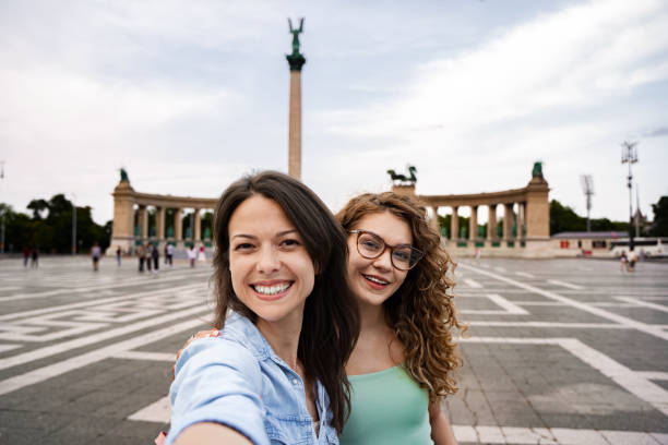 istock Exploring Heroes' Square in Budapest: Two friends capturing a joyful memory amidst historic monuments and vibrant atmosphere 2172576527