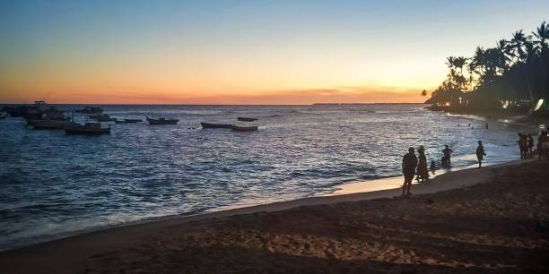 istock Golden Hour on a Tranquil Beach with Boats 2172577155