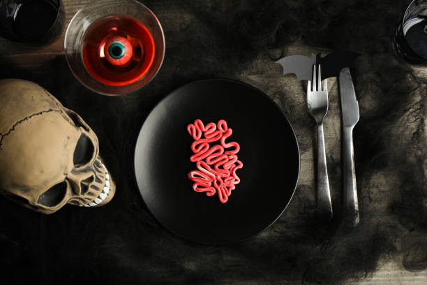 istock Spooky holiday table decorations with a skull for Halloween 2172577778