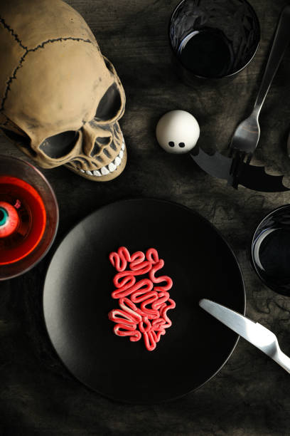 istock Spooky holiday table decorations with a skull for Halloween 2172577815