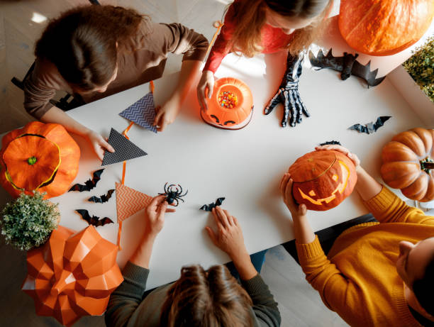 istock family preparing for Halloween 2172580212